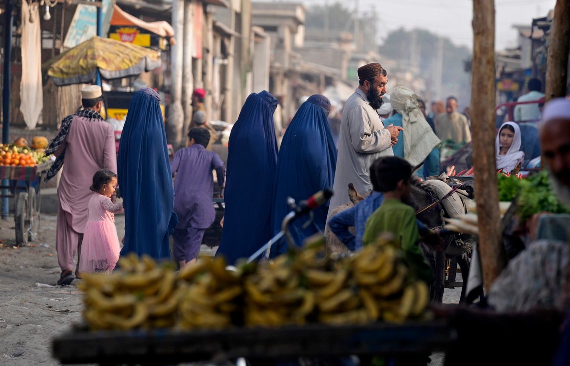 Burqa-clad Afghan women walk on a street with other in a a neighbourhood, where mostly Afghan populations, in Karachi, Pakistan, Friday, Jan. 26, 2024. For more than 1 million Afghans who fled war and poverty to Pakistan, these are uncertain times. Since Pakistan announced a crackdown on migrants last year, some 600,000 have been deported and at least a million remain in Pakistan in hiding. They've retreated from public view, abandoning their jobs and rarely leaving their neighborhoods out of fear they could be next. It's harder for them to earn money, rent accommodation, buy food or get medical help because they run the risk of getting caught by police or being reported to authorities by Pakistanis. (AP Photo/Fareed Khan) Burqa-clad Afghan women walk on a street with other in a a neighbourhood, where mostly Afghan populations, in Karachi, Pakistan, Friday, Jan. 26, 2024. For more than 1 million Afghans who fled war and poverty to Pakistan, these are uncertain times. Since Pakistan announced a crackdown on migrants last year, some 600,000 have been deported and at least a million remain in Pakistan in hiding. They've retreated from public view, abandoning their jobs and rarely leaving their neighborhoods out of fear they could be next. It's harder for them to earn money, rent accommodation, buy food or get medical help because they run the risk of getting caught by police or being reported to authorities by Pakistanis. (AP Photo/Fareed Khan)