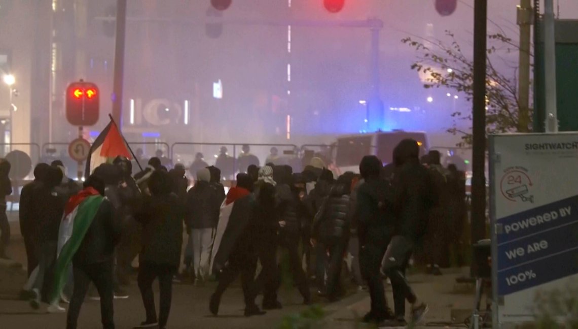In this image taken from video, a group of pro-Palestinian protesters walk toward police line, with police vans driving in the background, near the soccer stadium in Amsterdam, Netherlands, Thursday, Nov. 7, 2024. (RTL Nieuws via AP) In this image taken from video, a group of pro-Palestinian protesters walk toward police line, with police vans driving in the background, near the soccer stadium in Amsterdam, Netherlands, Thursday, Nov. 7, 2024. (RTL Nieuws via AP)