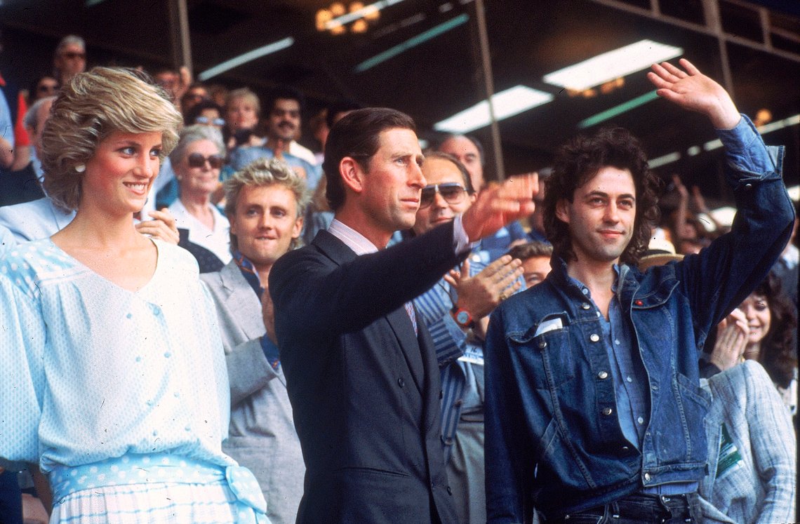 FILE - Princess Diana, left, and Prince Charles attend the Live Aid concert as they acknowledge the crowd with event organizer Bob Geldof, right, at London's Wembley Stadium, on July 13, 1985. Geldof's Live Aid concerts have raised millions. Those shows included performances by Queen, U2, Led Zeppelin and Madonna. He has hosted Live 8 concerts and convinced industrialized nations to pledge an increase in aid to Africa by $25 billion. (AP Photo/Joe Schaber, File) FILE - Princess Diana, left, and Prince Charles attend the Live Aid concert as they acknowledge the crowd with event organizer Bob Geldof, right, at London's Wembley Stadium, on July 13, 1985. Geldof's Live Aid concerts have raised millions. Those shows included performances by Queen, U2, Led Zeppelin and Madonna. He has hosted Live 8 concerts and convinced industrialized nations to pledge an increase in aid to Africa by $25 billion. (AP Photo/Joe Schaber, File)
