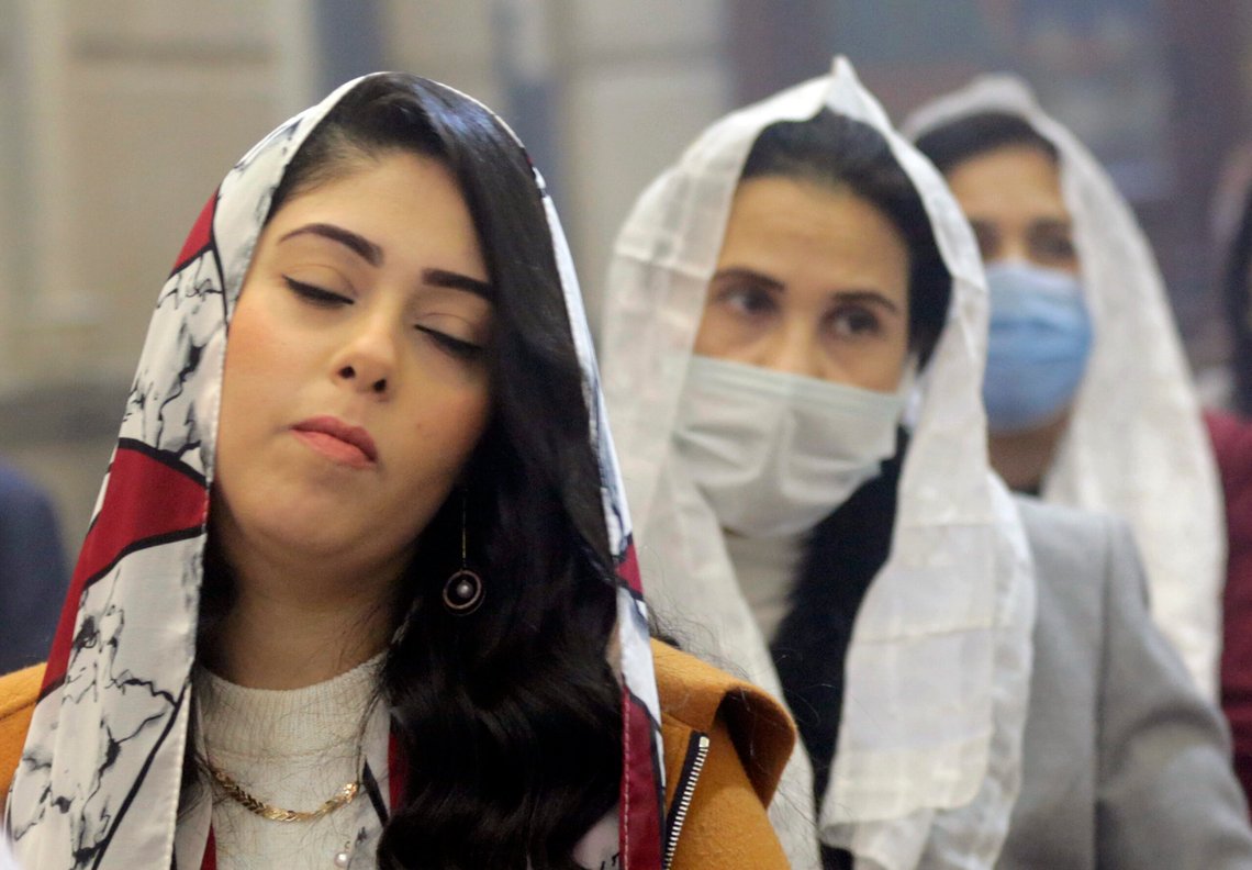 Egyptian Coptic Orthodox attend Midnight Mass on Orthodox Christmas Eve at Church of St. George in Cairo, Egypt, late Thursday, Jan. 6, 2022. Copts celebrate Christmas according to the Julian calendar, meaning it falls on Jan. 7. (AP Photo/Amr Nabil) Egyptian Coptic Orthodox attend Midnight Mass on Orthodox Christmas Eve at Church of St. George in Cairo, Egypt, late Thursday, Jan. 6, 2022. Copts celebrate Christmas according to the Julian calendar, meaning it falls on Jan. 7. (AP Photo/Amr Nabil)