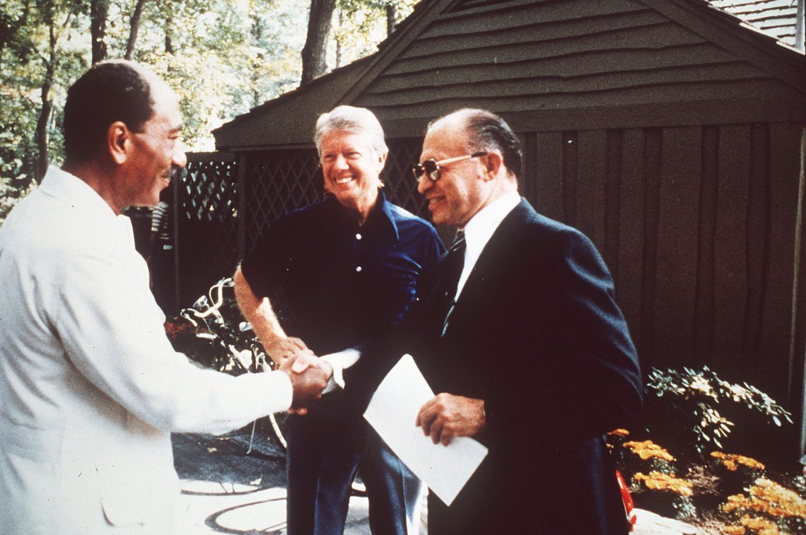 FILE - Egypt's President Anwar Sadat, left, shakes hands with Israeli Prime Minister Menachem Begin as President Jimmy Carter watches at Camp David, Md., in September 1978, during talks aimed at laying the groundwork for a permanent Middle East peace. (AP Photo, File) FILE - Egypt's President Anwar Sadat, left, shakes hands with Israeli Prime Minister Menachem Begin as President Jimmy Carter watches at Camp David, Md., in September 1978, during talks aimed at laying the groundwork for a permanent Middle East peace. (AP Photo, File)