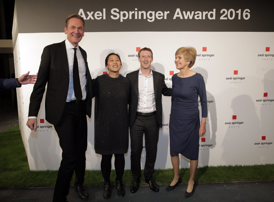 Mathias Doepfner, chairman of the Axel Springer SE, Priscilla and Mark Zuckerberg and publisher Friede Springer, from left, pose for a photograph as they arrive for the awarding ceremony of the newly established Axel Springer Award of the media group Axel Springer in Berlin Thursday, Feb. 25, 2016. (Kay Nietfeld/dpa via AP) Mathias Doepfner, chairman of the Axel Springer SE, Priscilla and Mark Zuckerberg and publisher Friede Springer, from left, pose for a photograph as they arrive for the awarding ceremony of the newly established Axel Springer Award of the media group Axel Springer in Berlin Thursday, Feb. 25, 2016. (Kay Nietfeld/dpa via AP)