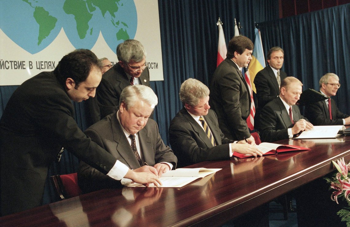 FILE - Russian President Boris Yeltsin, left, U.S. President Bill Clinton, Ukrainian President Leonid Kuchma, and British Prime Minister John Major, far right, sign the Nuclear Non-Proliferation Treaty during the Commission on Security and Cooperation in Europe (CSCE) summit in Budapest, Hungary, Monday, Dec. 5, 1994. A major United Nations meeting on the landmark nuclear Non-Proliferation Treaty is starting Monday, Aug. 1, 2022, after a long delay due to the COVID-19 pandemic, as Russia’s war in Ukraine has reanimated fears of nuclear confrontation and cranked up the urgency of trying reinforce the 50-year-old treaty. (AP Photo/Marcy Nighswander, File) FILE - Russian President Boris Yeltsin, left, U.S. President Bill Clinton, Ukrainian President Leonid Kuchma, and British Prime Minister John Major, far right, sign the Nuclear Non-Proliferation Treaty during the Commission on Security and Cooperation in Europe (CSCE) summit in Budapest, Hungary, Monday, Dec. 5, 1994. A major United Nations meeting on the landmark nuclear Non-Proliferation Treaty is starting Monday, Aug. 1, 2022, after a long delay due to the COVID-19 pandemic, as Russia’s war in Ukraine has reanimated fears of nuclear confrontation and cranked up the urgency of trying reinforce the 50-year-old treaty. (AP Photo/Marcy Nighswander, File)