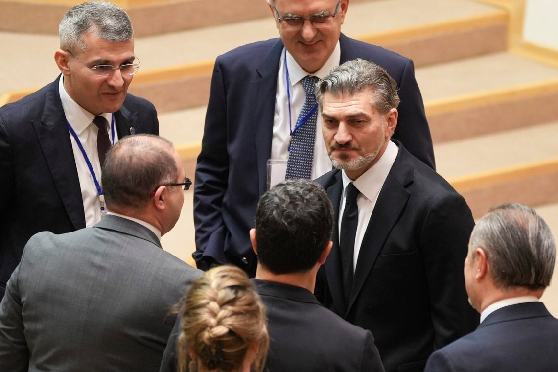 Georgian president-elect Mikheil Kavelashvili, center, is greeted by the electoral college members at the Georgian parliament in Tbilisi, Georgia, Saturday. Dec. 14, 2024. (AP Photo) Georgian president-elect Mikheil Kavelashvili, center, is greeted by the electoral college members at the Georgian parliament in Tbilisi, Georgia, Saturday. Dec. 14, 2024. (AP Photo)