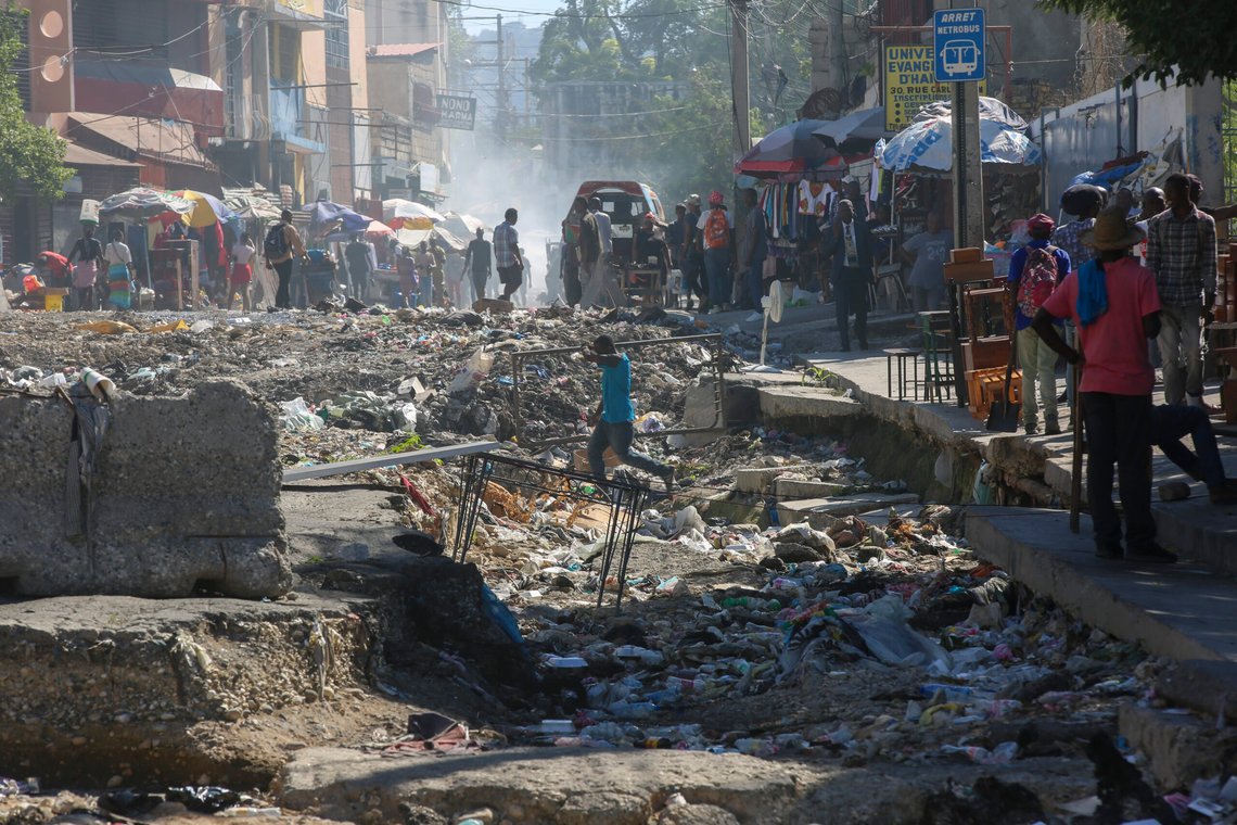 A man crosses a road destroyed by rains in Port-au-Prince, Haiti, Monday, Dec. 2, 2024. (AP Photo/Odelyn Joseph) A man crosses a road destroyed by rains in Port-au-Prince, Haiti, Monday, Dec. 2, 2024. (AP Photo/Odelyn Joseph)