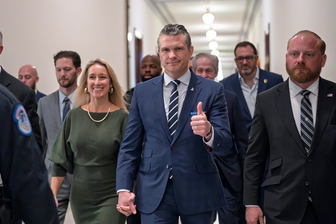 Pete Hegseth, President-elect Donald Trump's nominee to be Defense Secretary, gives a thumbs-up as he walks with his wife Jennifer Rauchet, left, to meet with Sen. Joni Ernst, R-Iowa, a member of the Senate Armed Services Committee, at the Capitol in Washington, Monday, Dec. 9, 2024. (AP Photo/J. Scott Applewhite) Pete Hegseth, President-elect Donald Trump's nominee to be Defense Secretary, gives a thumbs-up as he walks with his wife Jennifer Rauchet, left, to meet with Sen. Joni Ernst, R-Iowa, a member of the Senate Armed Services Committee, at the Capitol in Washington, Monday, Dec. 9, 2024. (AP Photo/J. Scott Applewhite)