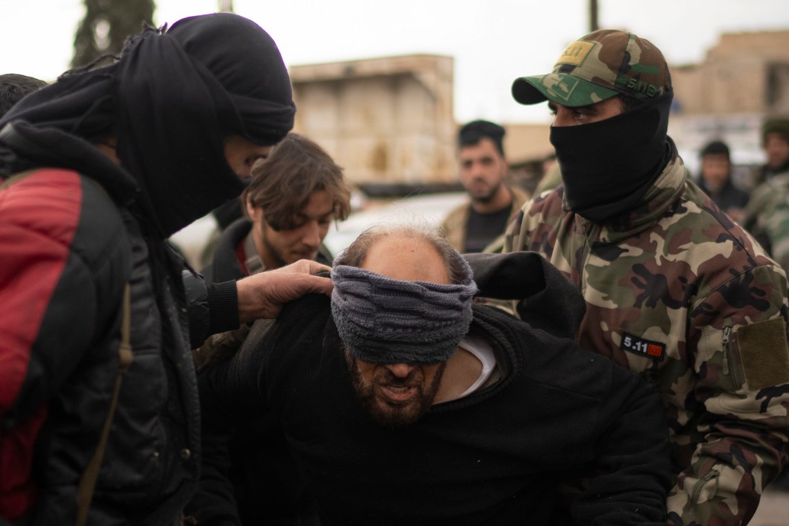 Members of the security forces of the newly formed Syrian government detain a man suspected of being part of the militias of the ousted president Bashar Assad in Adra, on the outskirts of Damascus, Syria, Monday, Dec. 30, 2024. (AP Photo/Leo Correa) Members of the security forces of the newly formed Syrian government detain a man suspected of being part of the militias of the ousted president Bashar Assad in Adra, on the outskirts of Damascus, Syria, Monday, Dec. 30, 2024. (AP Photo/Leo Correa)