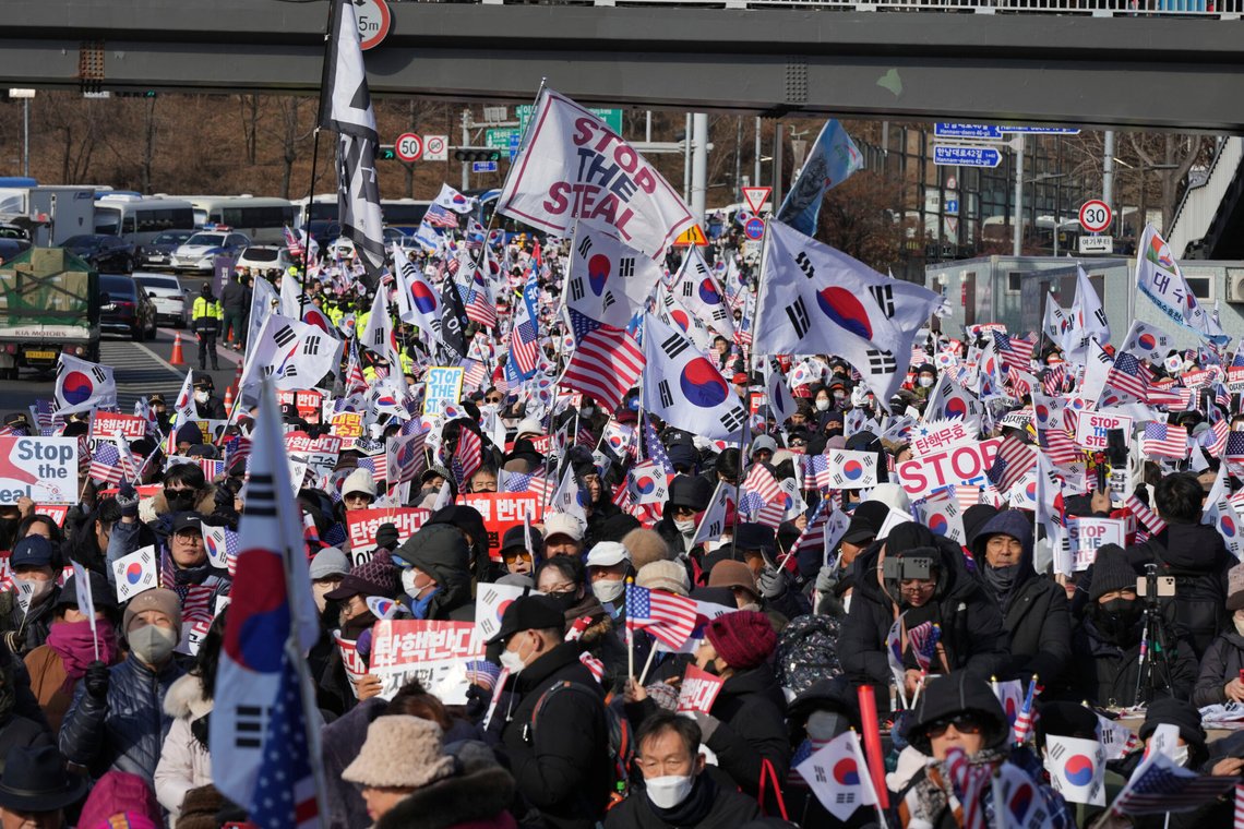 Supporters of impeached South Korean President Yoon Suk Yeol stage a rally to oppose a court having issued a warrant to detain Yoon, near the presidential residence in Seoul, South Korea, Friday, Jan. 3, 2025. The letters read, "Oppose Impeachment." (AP Photo/Lee Jin-man) Supporters of impeached South Korean President Yoon Suk Yeol stage a rally to oppose a court having issued a warrant to detain Yoon, near the presidential residence in Seoul, South Korea, Friday, Jan. 3, 2025. The letters read, "Oppose Impeachment." (AP Photo/Lee Jin-man)
