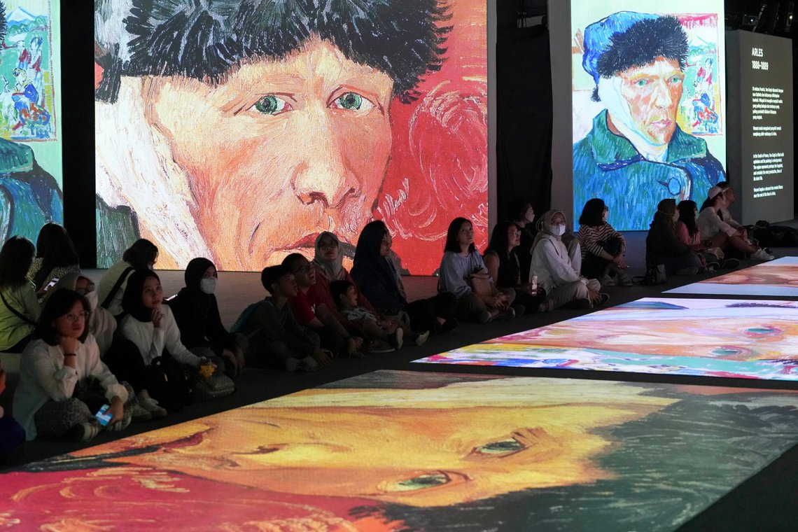 People watch visual animated montage of notable works by artist Vincent Van Gogh at the "Van Gogh Alive" exhibition at Taman Anggrek mall in Jakarta, Indonesia Wednesday, Aug. 9, 2023. (AP Photo/Tatan Syuflana) People watch visual animated montage of notable works by artist Vincent Van Gogh at the "Van Gogh Alive" exhibition at Taman Anggrek mall in Jakarta, Indonesia Wednesday, Aug. 9, 2023. (AP Photo/Tatan Syuflana)
