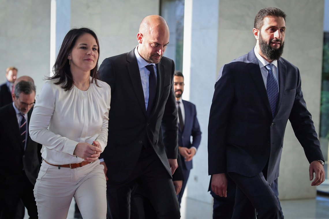 In this photo released by the Syrian official news agency SANA, Syria's de facto leader Ahmad al-Sharaa, formerly known as Abu Mohammed al-Golani, right, meets with German foreign minister, Annalena Baerbock, left, and French foreign minister, Jean-Noel Barrot, center, in Damascus, Syria, Friday, Jan. 3, 2025. (SANA via AP) In this photo released by the Syrian official news agency SANA, Syria's de facto leader Ahmad al-Sharaa, formerly known as Abu Mohammed al-Golani, right, meets with German foreign minister, Annalena Baerbock, left, and French foreign minister, Jean-Noel Barrot, center, in Damascus, Syria, Friday, Jan. 3, 2025. (SANA via AP)
