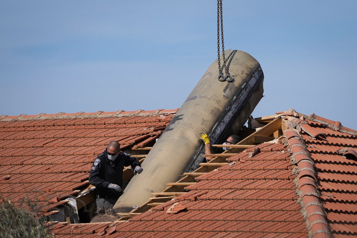 Israeli bomb squad police officers remove part of a missile fired by Yemen's Houthi rebels after it hit a house in the Israeli village of Mevo Beitar, near Jerusalem, on Tuesday, Jan. 14, 2025. (AP Photo/Ohad Zwigenberg) Israeli bomb squad police officers remove part of a missile fired by Yemen's Houthi rebels after it hit a house in the Israeli village of Mevo Beitar, near Jerusalem, on Tuesday, Jan. 14, 2025. (AP Photo/Ohad Zwigenberg)