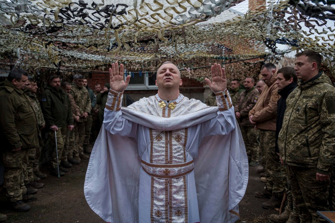 Military chaplain Yurii of the 24th Mechanized Brigade holds a church service for an infantry unit during Christmas near the frontline town of Chasiv Yar, Donetsk region, Ukraine, Wednesday Dec. 25, 2024. (AP Photo/Evgeniy Maloletka) Military chaplain Yurii of the 24th Mechanized Brigade holds a church service for an infantry unit during Christmas near the frontline town of Chasiv Yar, Donetsk region, Ukraine, Wednesday Dec. 25, 2024. (AP Photo/Evgeniy Maloletka)