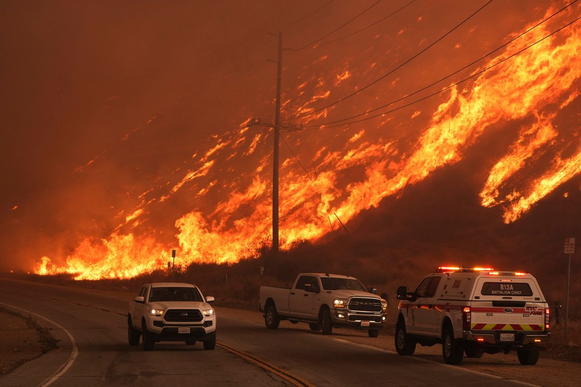 Firefighters monitor flames caused by the Hughes Fire along Castaic Lake in Castaic, Calif., Wednesday, Jan. 22, 2025. (AP Photo/Marcio Jose Sanchez) Firefighters monitor flames caused by the Hughes Fire along Castaic Lake in Castaic, Calif., Wednesday, Jan. 22, 2025. (AP Photo/Marcio Jose Sanchez)
