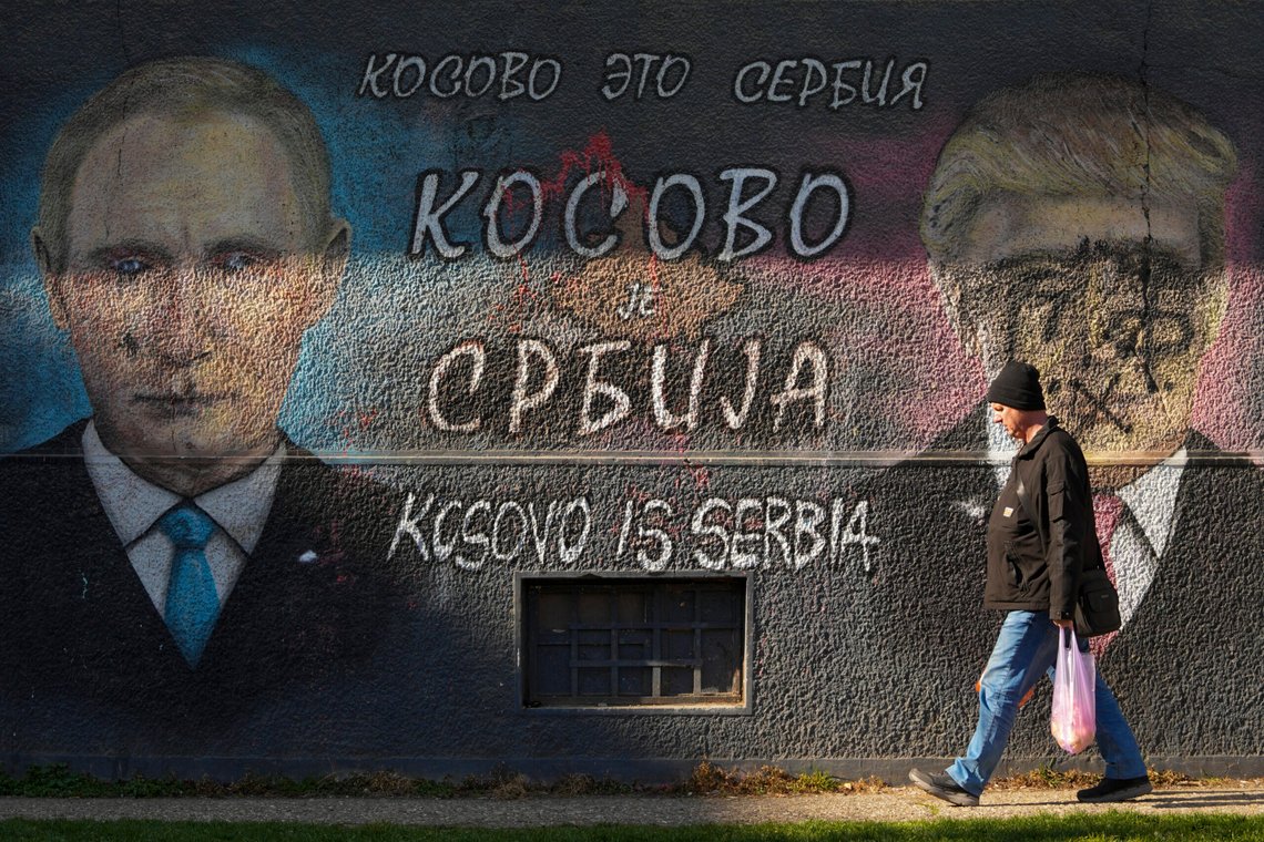 A man passes by a graffiti reading ''Kosovo is Serbia'' and depicting the Russian President Vladimir Putin, left, and U.S. President Donald Trump, vandalized with paint, in Belgrade, Serbia, Friday, Feb. 21, 2025. (AP Photo/Darko Vojinovic) A man passes by a graffiti reading ''Kosovo is Serbia'' and depicting the Russian President Vladimir Putin, left, and U.S. President Donald Trump, vandalized with paint, in Belgrade, Serbia, Friday, Feb. 21, 2025. (AP Photo/Darko Vojinovic)