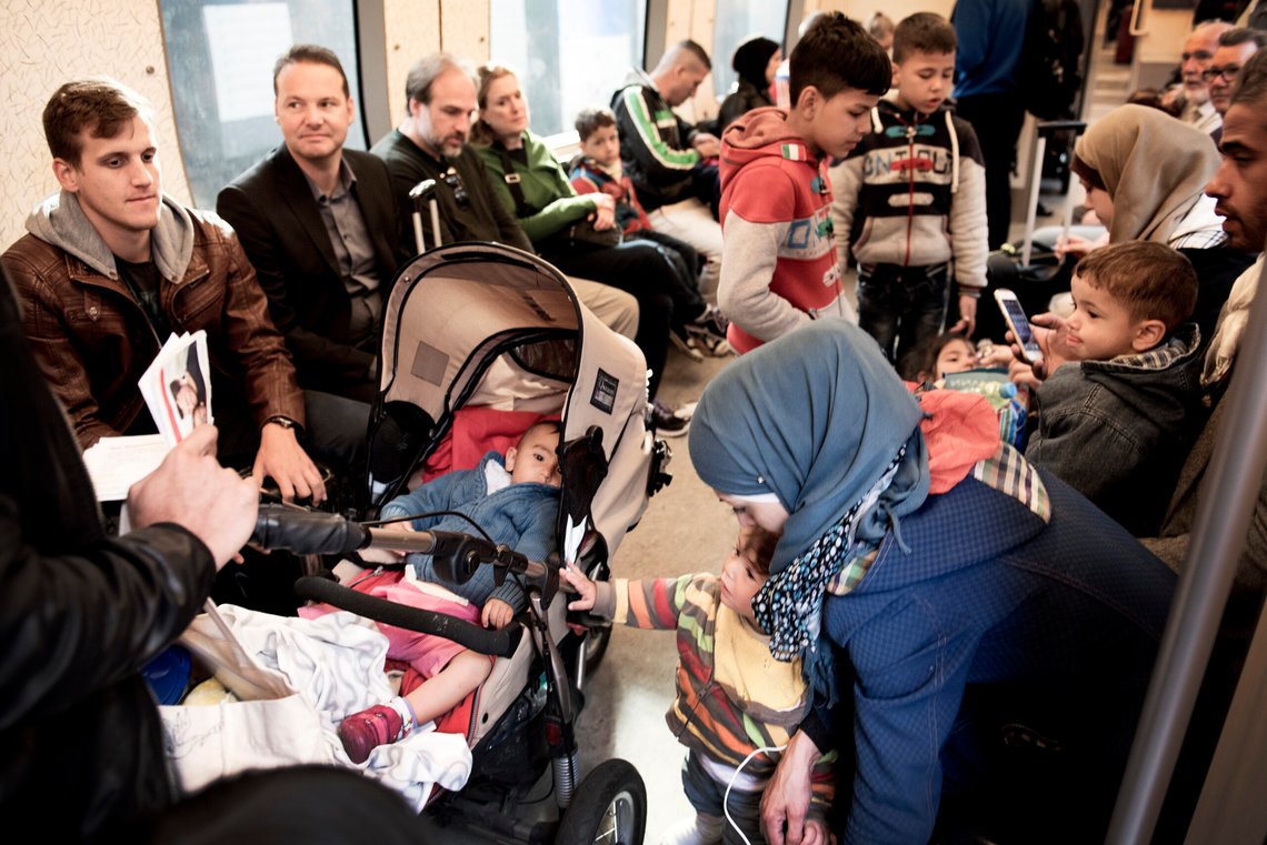 Migrants sits in a train headed to Sweden leaving Copenhagen Central Station September 10, 2015. (Foto: Linda Kastrup/Scanpix 2015) Migrants sits in a train headed to Sweden leaving Copenhagen Central Station September 10, 2015. (Foto: Linda Kastrup/Scanpix 2015)