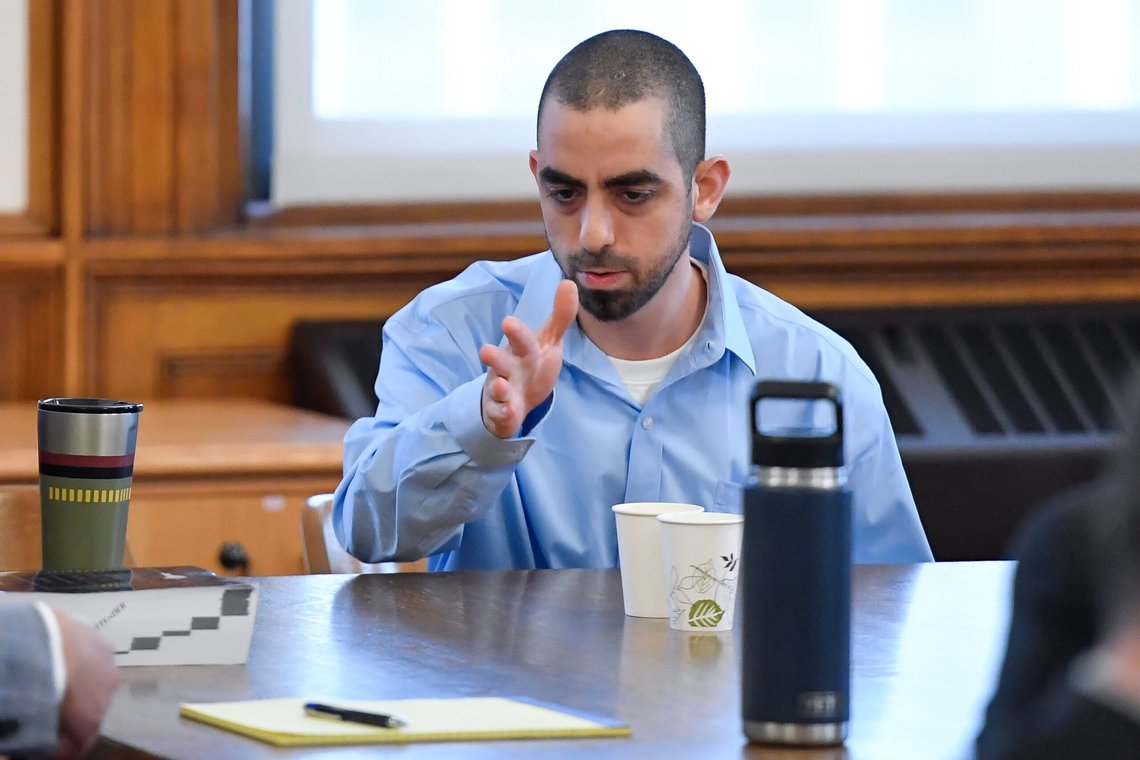 Hadi Matar, right, charged with severely injuring author Salman Rushdie in a 2022 knife attack, speaks to his defense team in Chautauqua County court in Mayville, N.Y., Monday, Feb. 10, 2025. (AP Photo/Adrian Kraus) Hadi Matar, right, charged with severely injuring author Salman Rushdie in a 2022 knife attack, speaks to his defense team in Chautauqua County court in Mayville, N.Y., Monday, Feb. 10, 2025. (AP Photo/Adrian Kraus)