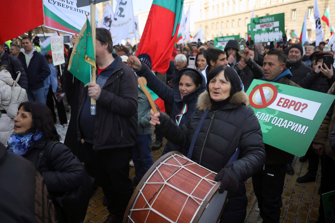 Protesters shout anti-government slogans during nationalist protests demanding the government to scrap plans to take the country into the eurozone, Sofia, Saturday, Feb. 22, 2025. (AP Photo/Valentina Petrova) Protesters shout anti-government slogans during nationalist protests demanding the government to scrap plans to take the country into the eurozone, Sofia, Saturday, Feb. 22, 2025. (AP Photo/Valentina Petrova)