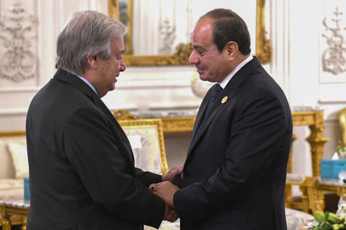 In this photo provided by Egypt's presidency media office, Egyptian President Abdel Fattah el-Sissi, right, greets United Nations Secretary-General Antonio Guterres, during the International peace summit pose for a group picture at the New Administrative Capital, just outside Cairo, Egypt, Saturday, Oct. 21, 2023. (Egyptian Presidency Media Office via AP) In this photo provided by Egypt's presidency media office, Egyptian President Abdel Fattah el-Sissi, right, greets United Nations Secretary-General Antonio Guterres, during the International peace summit pose for a group picture at the New Administrative Capital, just outside Cairo, Egypt, Saturday, Oct. 21, 2023. (Egyptian Presidency Media Office via AP)