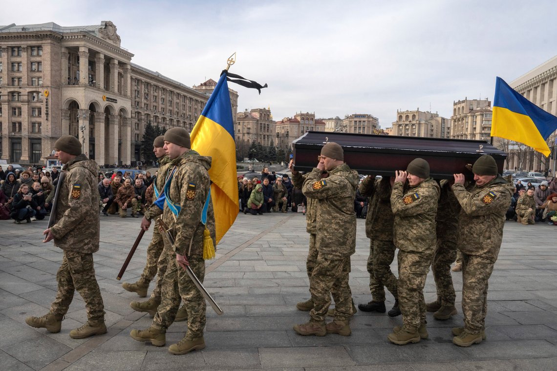 People kneel down as Ukrainian servicemen carry the coffin of their fellow-soldier Vasyl Ratushnyy, 28 during the funeral ceremony in the Independence square in Kyiv, Ukraine, Wednesday, March 5, 2025. (AP Photo/Efrem Lukatsky) People kneel down as Ukrainian servicemen carry the coffin of their fellow-soldier Vasyl Ratushnyy, 28 during the funeral ceremony in the Independence square in Kyiv, Ukraine, Wednesday, March 5, 2025. (AP Photo/Efrem Lukatsky)
