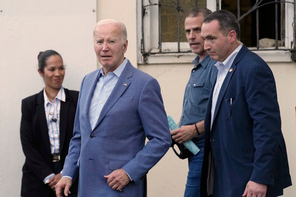 President Joe Biden listens as a reporter asks a question as he leaves Holy Cross Catholic Church in Christiansted, St. Croix, U.S. Virgin Islands, Saturday, Dec. 28, 2024, after attending mass with his son Hunter Biden, second from right. (AP Photo/Susan Walsh) President Joe Biden listens as a reporter asks a question as he leaves Holy Cross Catholic Church in Christiansted, St. Croix, U.S. Virgin Islands, Saturday, Dec. 28, 2024, after attending mass with his son Hunter Biden, second from right. (AP Photo/Susan Walsh)