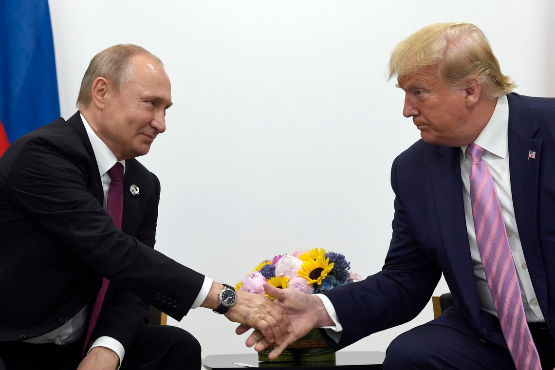 FILE - President Donald Trump, right, shakes hands with Russian President Vladimir Putin, left, during a bilateral meeting on the sidelines of the G-20 summit in Osaka, Japan, June 28, 2019. (AP Photo/Susan Walsh, File) FILE - President Donald Trump, right, shakes hands with Russian President Vladimir Putin, left, during a bilateral meeting on the sidelines of the G-20 summit in Osaka, Japan, June 28, 2019. (AP Photo/Susan Walsh, File)