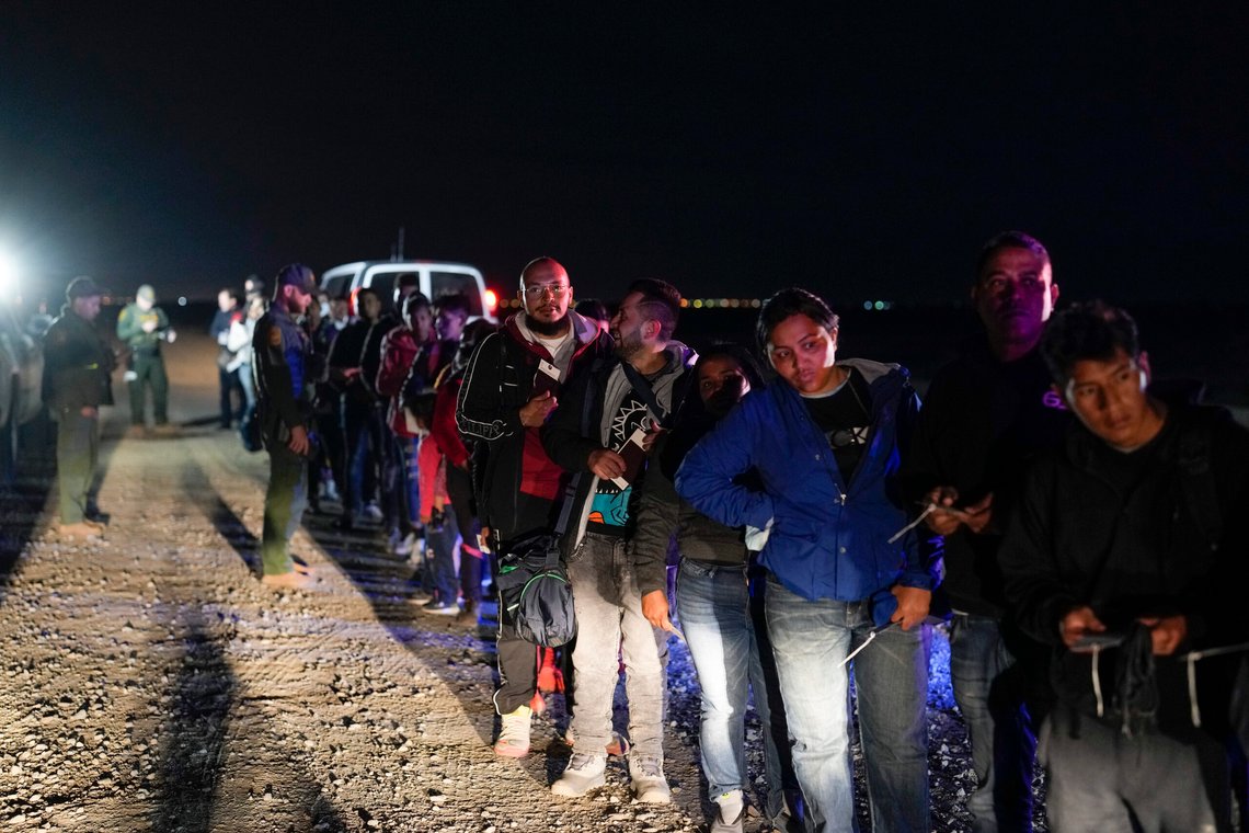 Migrants wait to be processed to seek asylum after crossing the border into the United States, Friday, Jan. 6, 2023, near Yuma, Ariz. President Joe Biden says the U.S. will immediately begin turning away Cubans, Haitians and Nicaraguans who cross the border from Mexico illegally. It's his boldest move yet to confront spiraling arrivals of migrants since he took office two years ago. (AP Photo/Gregory Bull) Migrants wait to be processed to seek asylum after crossing the border into the United States, Friday, Jan. 6, 2023, near Yuma, Ariz. President Joe Biden says the U.S. will immediately begin turning away Cubans, Haitians and Nicaraguans who cross the border from Mexico illegally. It's his boldest move yet to confront spiraling arrivals of migrants since he took office two years ago. (AP Photo/Gregory Bull)