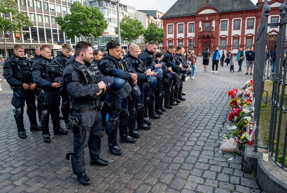 FILE - German police officers commemorate a colleague in Mannheim Germany, after learning that a police officer, who was stabbed two days ago there has died on Sunday, June 2, 2024. German authorities say they now see evidence of an Islamic extremist motive in last week's knife attack in the southwestern city of Mannheim in which a police officer was fatally injured. (AP Photo/Michael Probst, File) FILE - German police officers commemorate a colleague in Mannheim Germany, after learning that a police officer, who was stabbed two days ago there has died on Sunday, June 2, 2024. German authorities say they now see evidence of an Islamic extremist motive in last week's knife attack in the southwestern city of Mannheim in which a police officer was fatally injured. (AP Photo/Michael Probst, File)