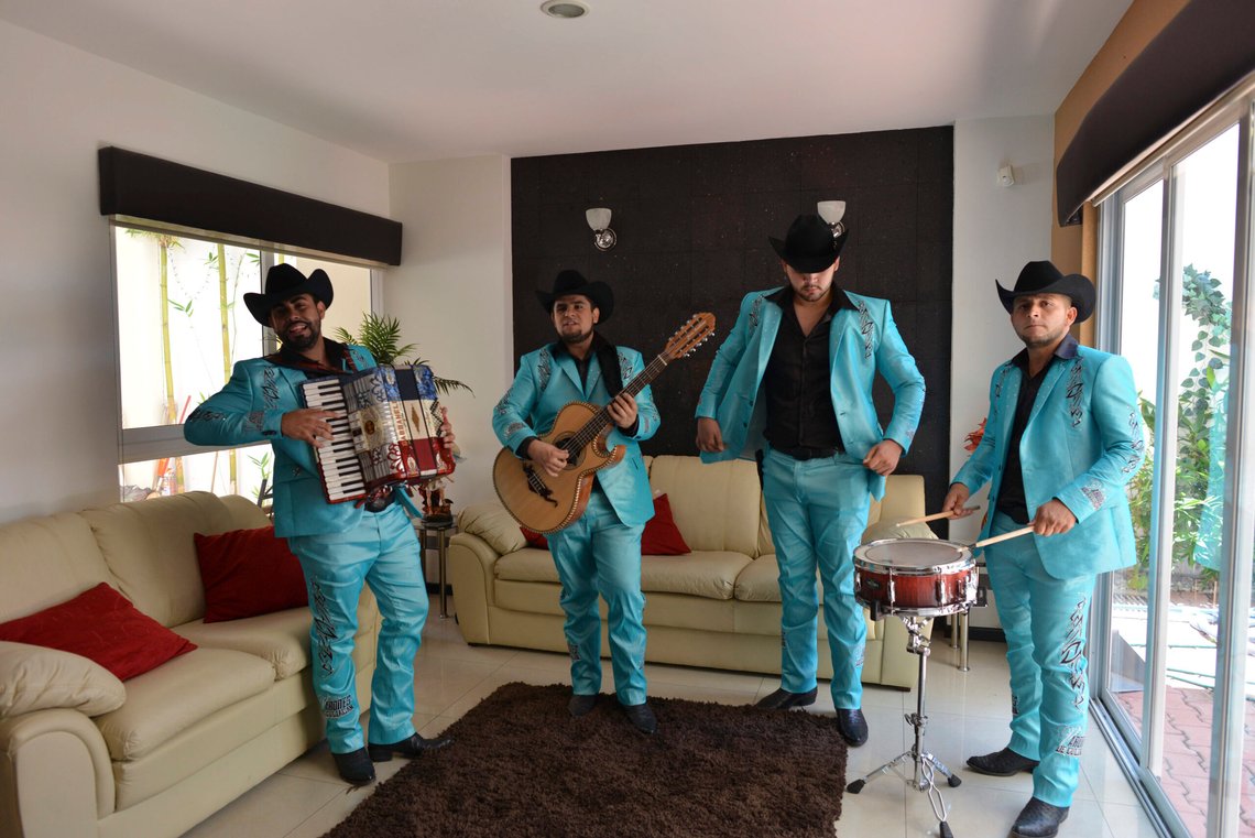FILE - Members of "Los Varones de Culiacan" perform during an interview in their manager's home in Culiacan, Mexico, July 23, 2015. The band composed a song based on a prison escape by drug kingpin Joaquin "El Chapo" Guzman. (AP Photo/Fernando Brito, File) FILE - Members of "Los Varones de Culiacan" perform during an interview in their manager's home in Culiacan, Mexico, July 23, 2015. The band composed a song based on a prison escape by drug kingpin Joaquin "El Chapo" Guzman. (AP Photo/Fernando Brito, File)