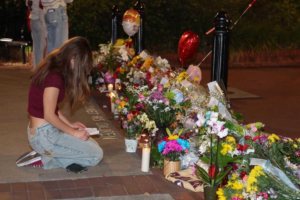 An impromptu memorial shared online brings students bearing flowers into the evening near the center of the Florida State campus in sight of the Student Union building, Tallahassee, Fla., Thursday, April 17, 2025. (AP Photo/Gary McCullough) An impromptu memorial shared online brings students bearing flowers into the evening near the center of the Florida State campus in sight of the Student Union building, Tallahassee, Fla., Thursday, April 17, 2025. (AP Photo/Gary McCullough)