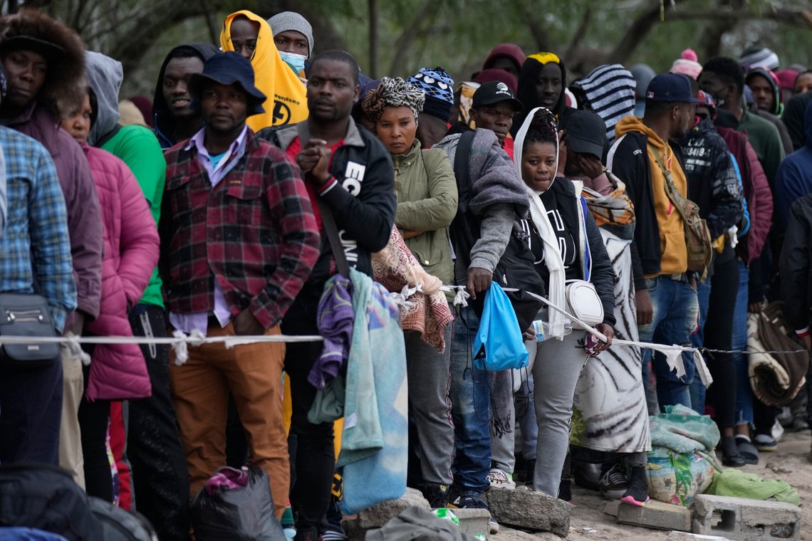 FILE - Haitian migrants who hope to apply for asylum in the U.S. wait to register their names on a list made by a religious organization in Reynosa, Mexico, Dec. 21, 2022, on the other side of the border with McAllen, Texas. (AP Photo/Fernando Llano, File) FILE - Haitian migrants who hope to apply for asylum in the U.S. wait to register their names on a list made by a religious organization in Reynosa, Mexico, Dec. 21, 2022, on the other side of the border with McAllen, Texas. (AP Photo/Fernando Llano, File)