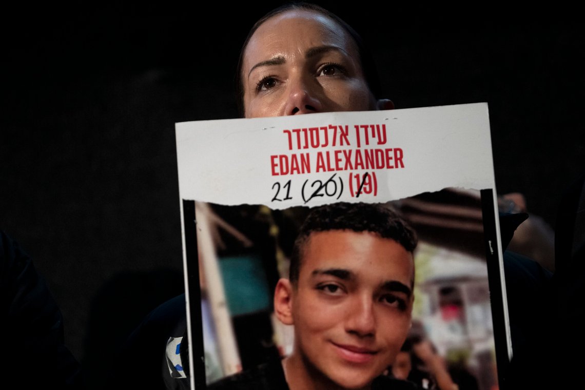 FILE - Yael Alexander holds a poster of her son, Edan, who was taken hostage by Hamas militants on Oct. 7, 2023, during a weekly rally for families of hostages held in the Gaza Strip and their supporters, in Tel Aviv, Israel, Feb. 22, 2025. (AP Photo/Maya Alleruzzo, File) FILE - Yael Alexander holds a poster of her son, Edan, who was taken hostage by Hamas militants on Oct. 7, 2023, during a weekly rally for families of hostages held in the Gaza Strip and their supporters, in Tel Aviv, Israel, Feb. 22, 2025. (AP Photo/Maya Alleruzzo, File)
