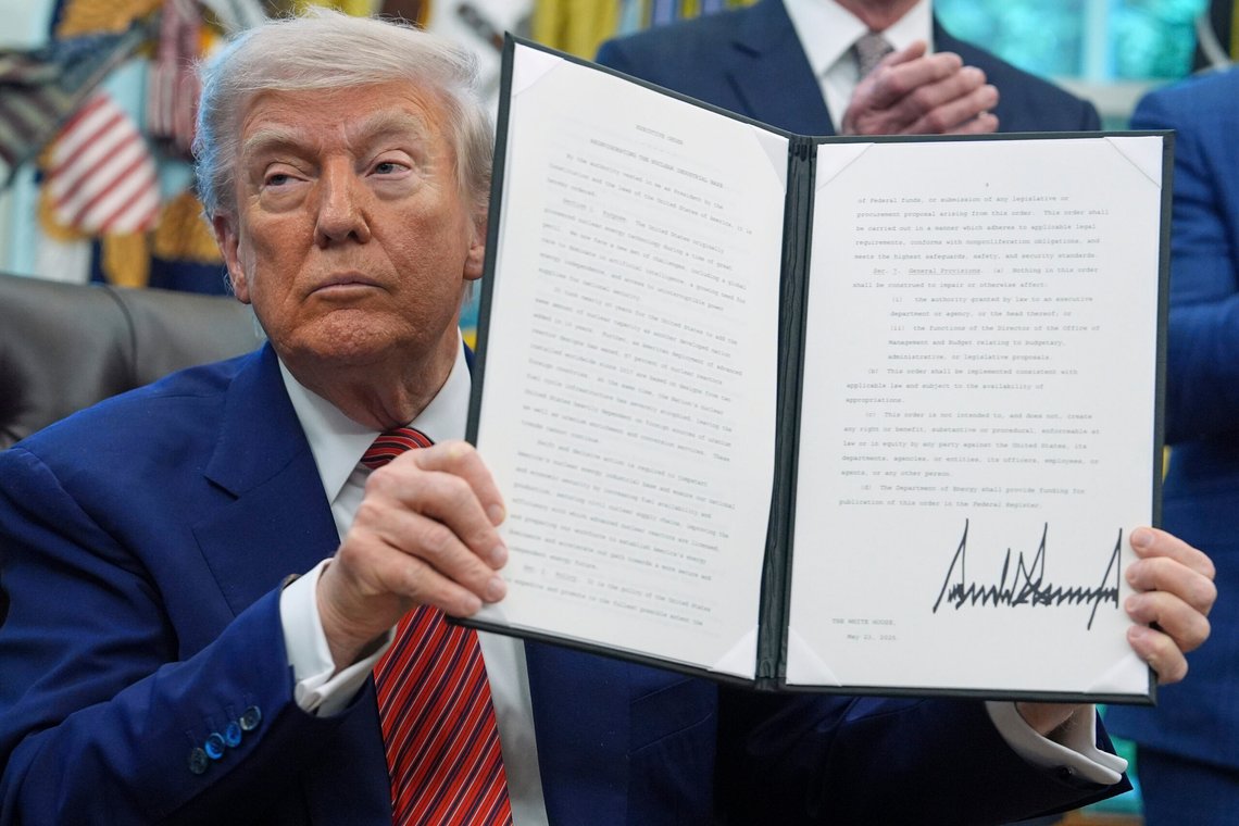 President Donald Trump holds an executive order regarding reinvigorating the nuclear industrial base, in the Oval Office of the White House, Friday, May 23, 2025, in Washington. (AP Photo/Evan Vucci) President Donald Trump holds an executive order regarding reinvigorating the nuclear industrial base, in the Oval Office of the White House, Friday, May 23, 2025, in Washington. (AP Photo/Evan Vucci)