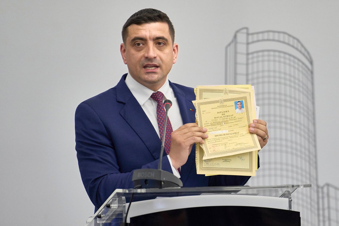 Presidential candidate George Simion shows his high school and university graduation diplomas while meeting members of the business community at the Chamber of Commerce and Industry of Romania, days ahead of the second round of the presidential election redo in Bucharest, Romania, Tuesday, May 13, 2025. (AP Photo/Vadim Ghirda) Presidential candidate George Simion shows his high school and university graduation diplomas while meeting members of the business community at the Chamber of Commerce and Industry of Romania, days ahead of the second round of the presidential election redo in Bucharest, Romania, Tuesday, May 13, 2025. (AP Photo/Vadim Ghirda)