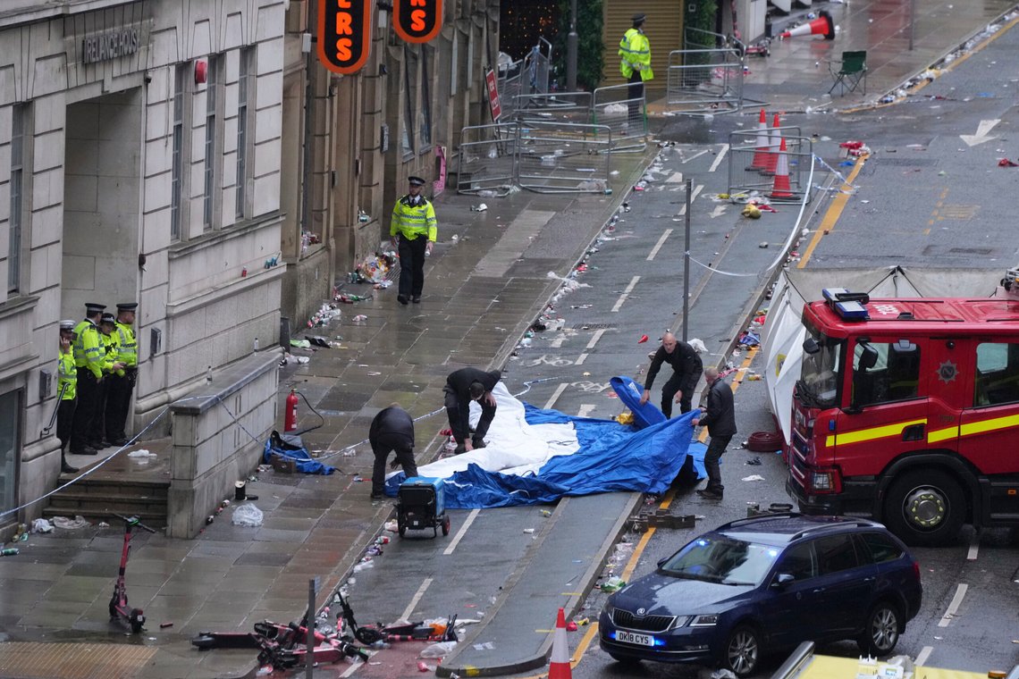 Police and emergency personnel deal with an incident after a car collided with pedestrians near the Liver Building during the Premier League winners parade in Liverpool, England, Monday, May 26, 2025.(AP Photo/Jon Super) Police and emergency personnel deal with an incident after a car collided with pedestrians near the Liver Building during the Premier League winners parade in Liverpool, England, Monday, May 26, 2025.(AP Photo/Jon Super)