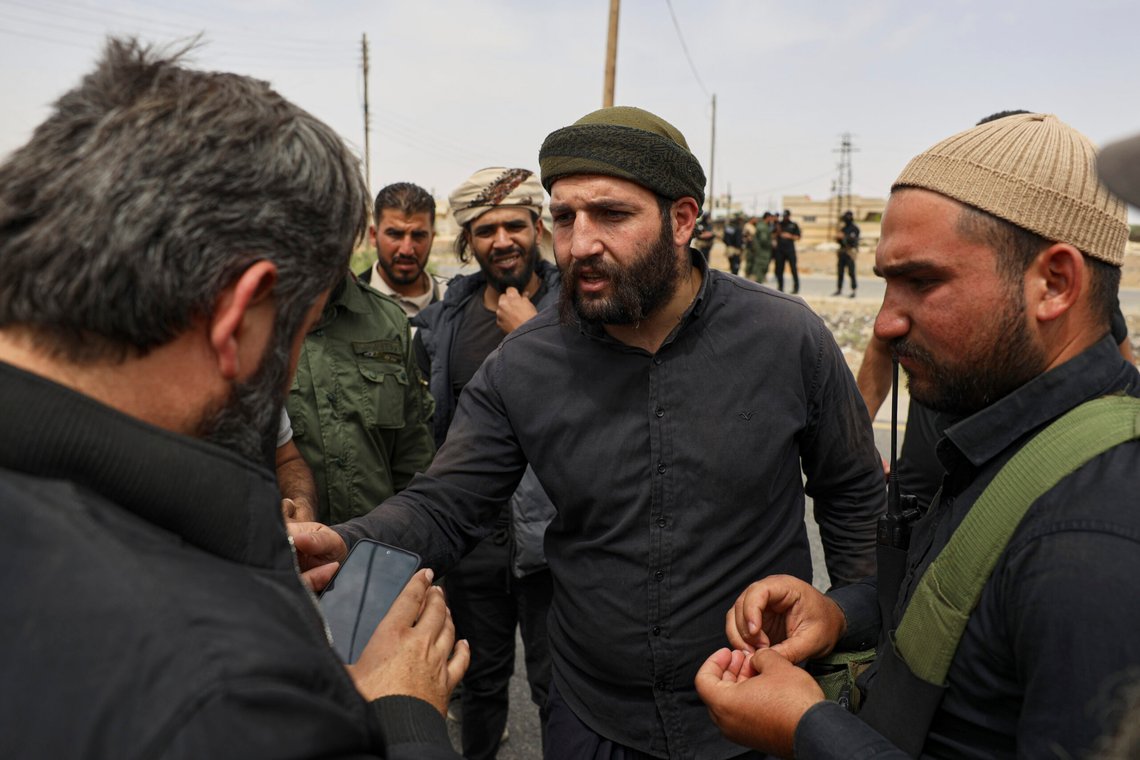 Sheikh Laith al-Balous, centre, a Druze leader in the southern Sweida province, speaks with Sweida governor Mustafa al-Bakour, left, at a highway where they found bodies of Syrian Druze fighters who were in a convoy heading from the southern Sweida province towards the capital to support their people, at al-Sor al-Kobra village, southern Syria, Thursday, May 1, 2025. (AP Photo/Omar Albam) Sheikh Laith al-Balous, centre, a Druze leader in the southern Sweida province, speaks with Sweida governor Mustafa al-Bakour, left, at a highway where they found bodies of Syrian Druze fighters who were in a convoy heading from the southern Sweida province towards the capital to support their people, at al-Sor al-Kobra village, southern Syria, Thursday, May 1, 2025. (AP Photo/Omar Albam)