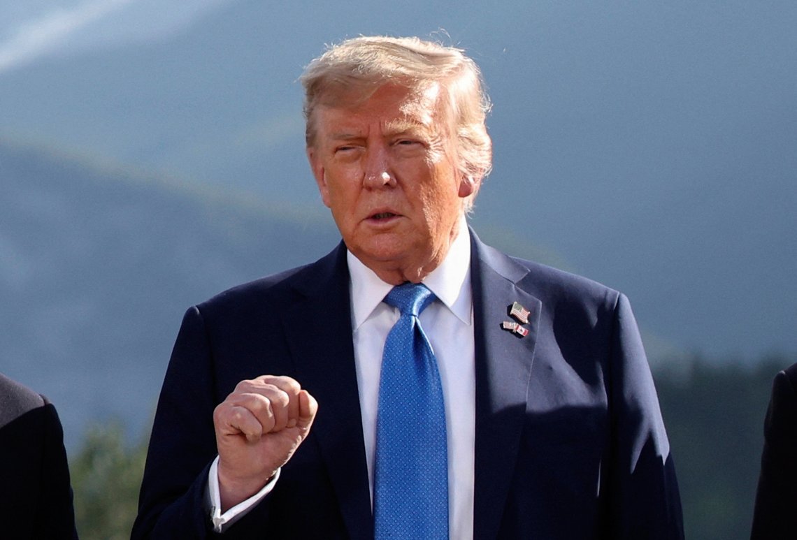 U.S. President Donald Trump gestures as he attends a family photo session during the G7 Summit, in Kananaskis, Alberta, Monday, June 16, 2025. (Suzanne Plunkett/Pool Photo via AP) U.S. President Donald Trump gestures as he attends a family photo session during the G7 Summit, in Kananaskis, Alberta, Monday, June 16, 2025. (Suzanne Plunkett/Pool Photo via AP)