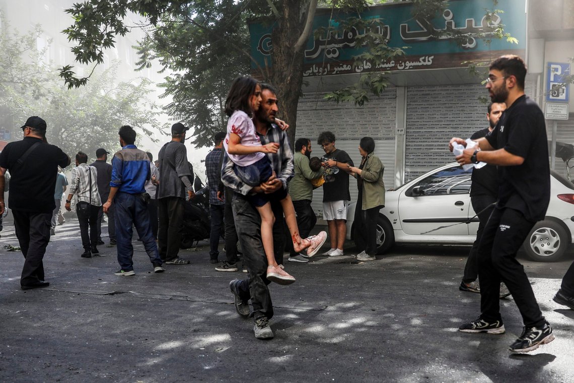 A man carries a wounded girl after an explosion in downtown Tehran amid Israel's two-day campaign of strikes against Iran, Sunday, June 15, 2025. (AP Photo/Morteza Zangene/ISNA) A man carries a wounded girl after an explosion in downtown Tehran amid Israel's two-day campaign of strikes against Iran, Sunday, June 15, 2025. (AP Photo/Morteza Zangene/ISNA)