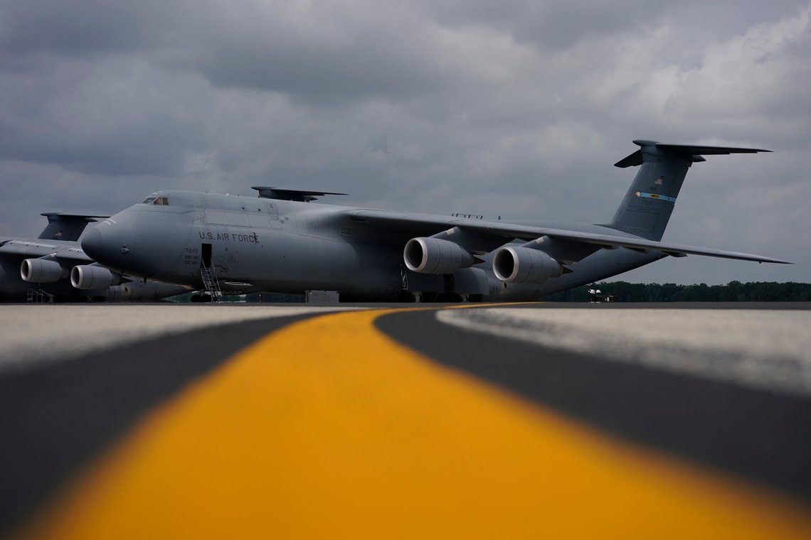 A C-5M Super Galaxy transport plane sits on the flightline at Dover Air Force Base, Del., Monday, June 21, 2021. The aircraft is one of those used in dignified transfer of remains, conducted upon arrival at Dover Air Force Base to honor those who have died while serving in a military theater of operations. (AP Photo/Carolyn Kaster) A C-5M Super Galaxy transport plane sits on the flightline at Dover Air Force Base, Del., Monday, June 21, 2021. The aircraft is one of those used in dignified transfer of remains, conducted upon arrival at Dover Air Force Base to honor those who have died while serving in a military theater of operations. (AP Photo/Carolyn Kaster)