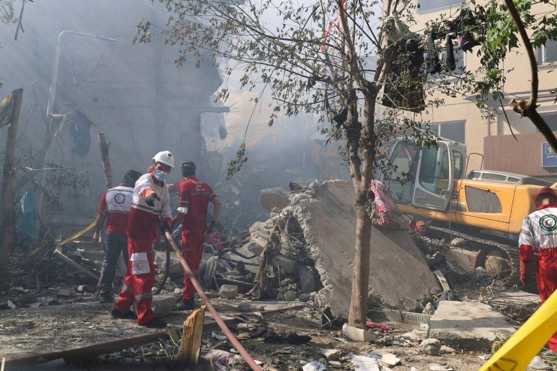 In this photo released by the Iranian Red Crescent Society rescuers work at the scene of an explosion after an Israeli strike in Tehran, Iran, Friday, June 13, 2025. (Iranian Red Crescent Society via AP) In this photo released by the Iranian Red Crescent Society rescuers work at the scene of an explosion after an Israeli strike in Tehran, Iran, Friday, June 13, 2025. (Iranian Red Crescent Society via AP)