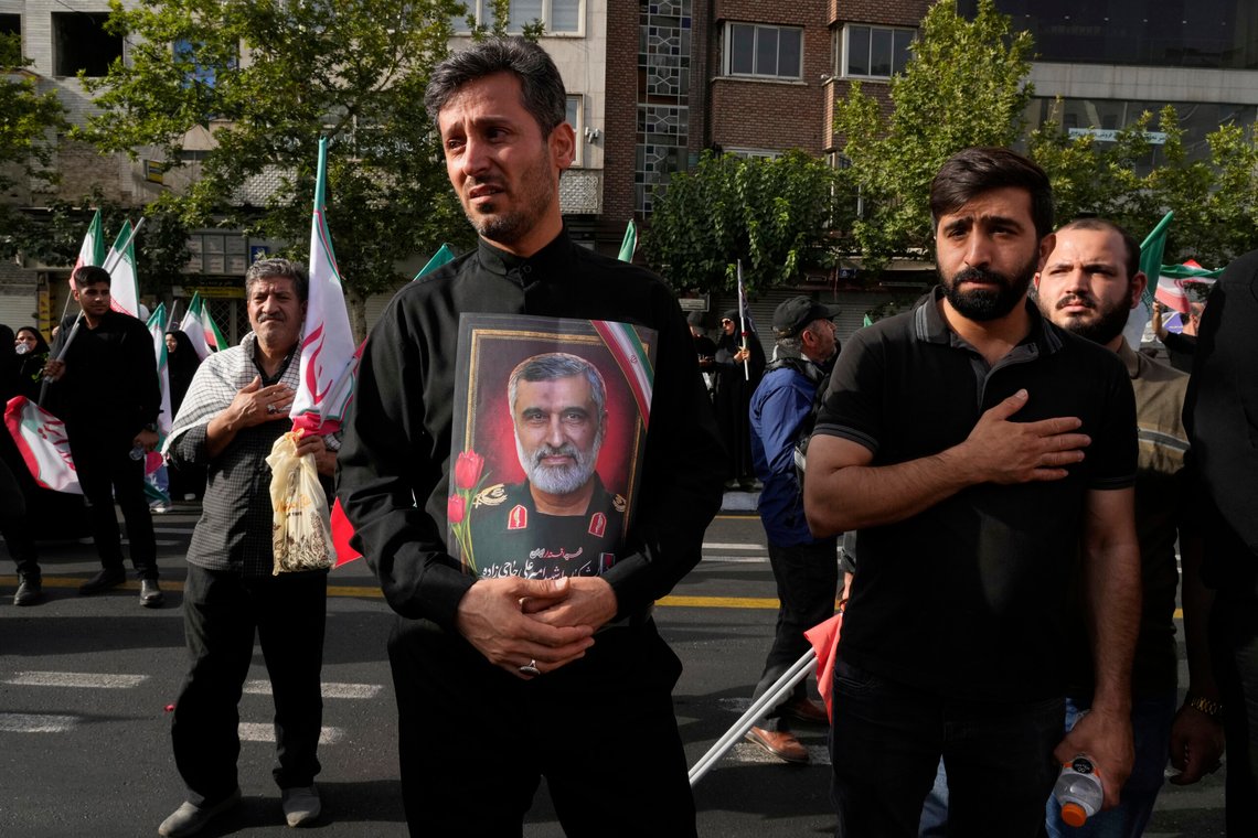 A man holds a picture of Iran's late head of the Revolutionary Guard’s ballistic missile program, Gen. Amir Ali Hajizadeh during the funeral ceremony of him, some other Iranian armed forces generals, nuclear scientists and their family members, who were killed in a 12-day war with Israel, in Tehran, Iran, Saturday, June 28, 2025. (AP Photo/Vahid Salemi) A man holds a picture of Iran's late head of the Revolutionary Guard’s ballistic missile program, Gen. Amir Ali Hajizadeh during the funeral ceremony of him, some other Iranian armed forces generals, nuclear scientists and their family members, who were killed in a 12-day war with Israel, in Tehran, Iran, Saturday, June 28, 2025. (AP Photo/Vahid Salemi)