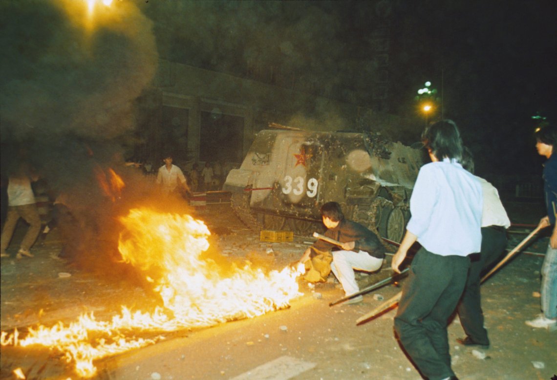 Student protesters put a barricade in front of a burning armored personnel carrier that rammed through student lines, June 4, 1989. Many were injured during an army attack on pro-democracy demonstrators in Beijing Tienanmen Square. (AP Photo) Student protesters put a barricade in front of a burning armored personnel carrier that rammed through student lines, June 4, 1989. Many were injured during an army attack on pro-democracy demonstrators in Beijing Tienanmen Square. (AP Photo)