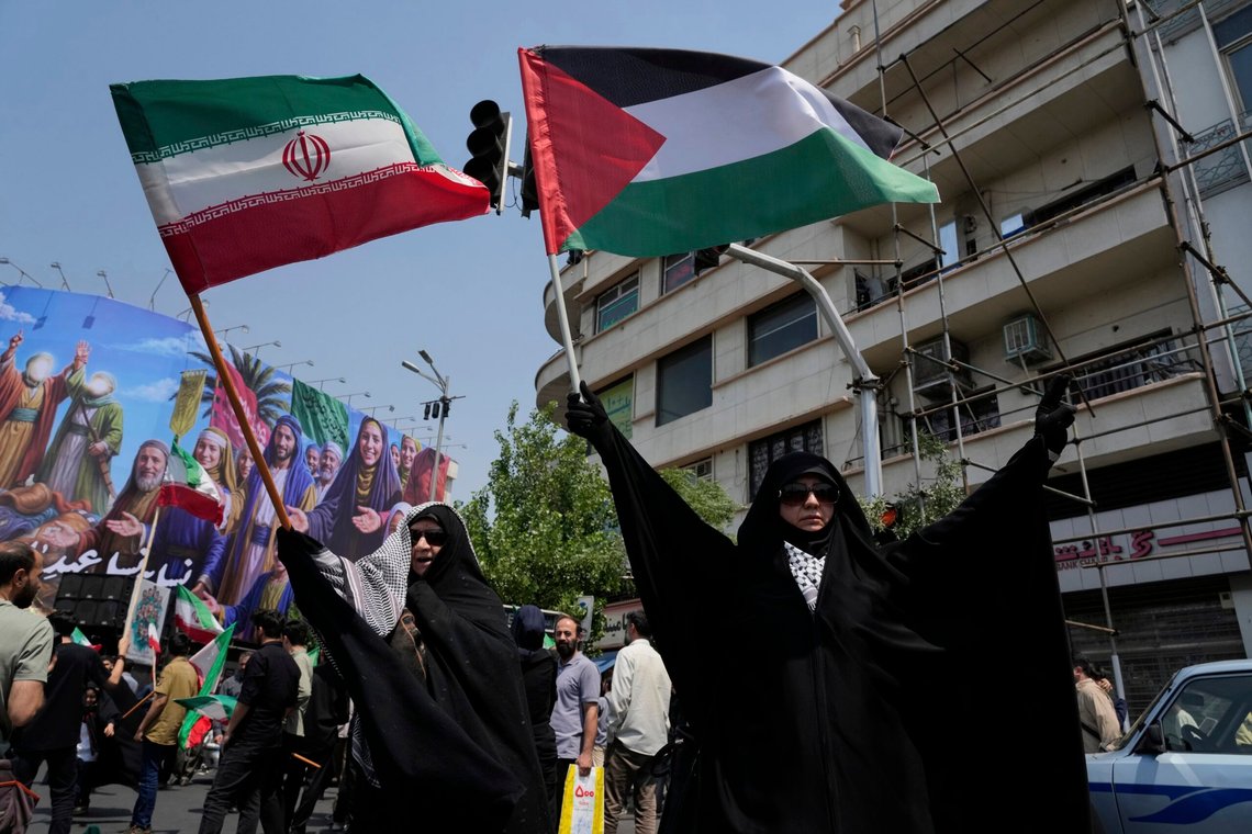 Iranian protesters hold up Iranian and Palestinian flags in an anti-Israeli gathering in Tehran, Iran, Friday, June 13, 2025. (AP Photo/Vahid Salemi) Iranian protesters hold up Iranian and Palestinian flags in an anti-Israeli gathering in Tehran, Iran, Friday, June 13, 2025. (AP Photo/Vahid Salemi)