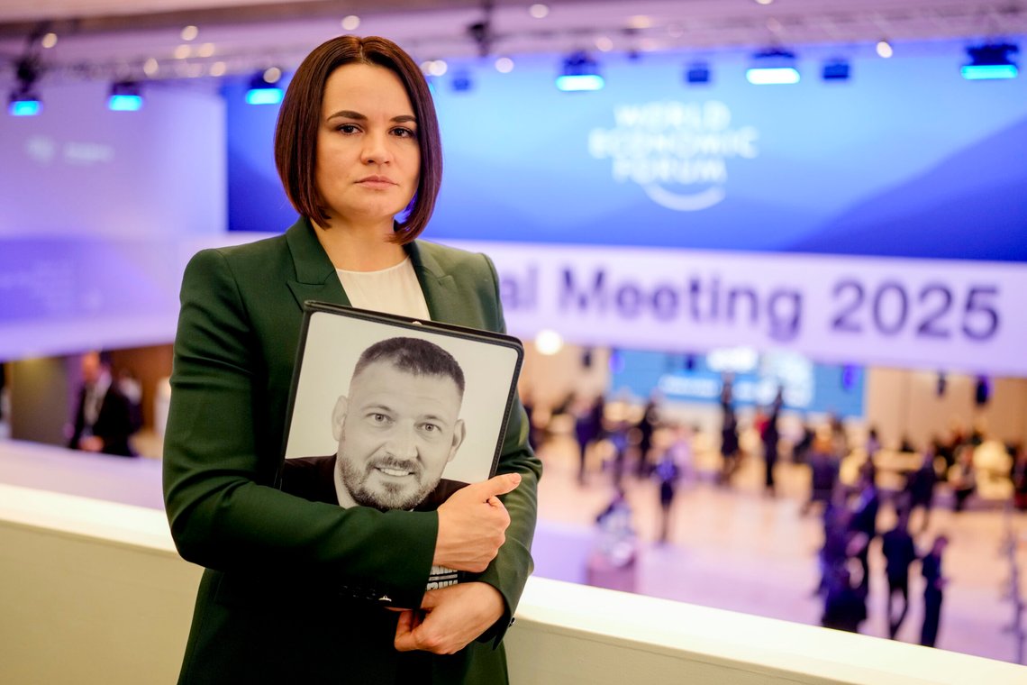 FILE – Belarusian opposition leader Sviatlana Tsikhanouskaya holds a photo of her imprisoned husband, Syarhei Tsikhanouski, at the annual World Economic Forum in Davos, Switzerland, on Jan. 21, 2025. (AP Photo/Markus Schreiber, File) FILE – Belarusian opposition leader Sviatlana Tsikhanouskaya holds a photo of her imprisoned husband, Syarhei Tsikhanouski, at the annual World Economic Forum in Davos, Switzerland, on Jan. 21, 2025. (AP Photo/Markus Schreiber, File)