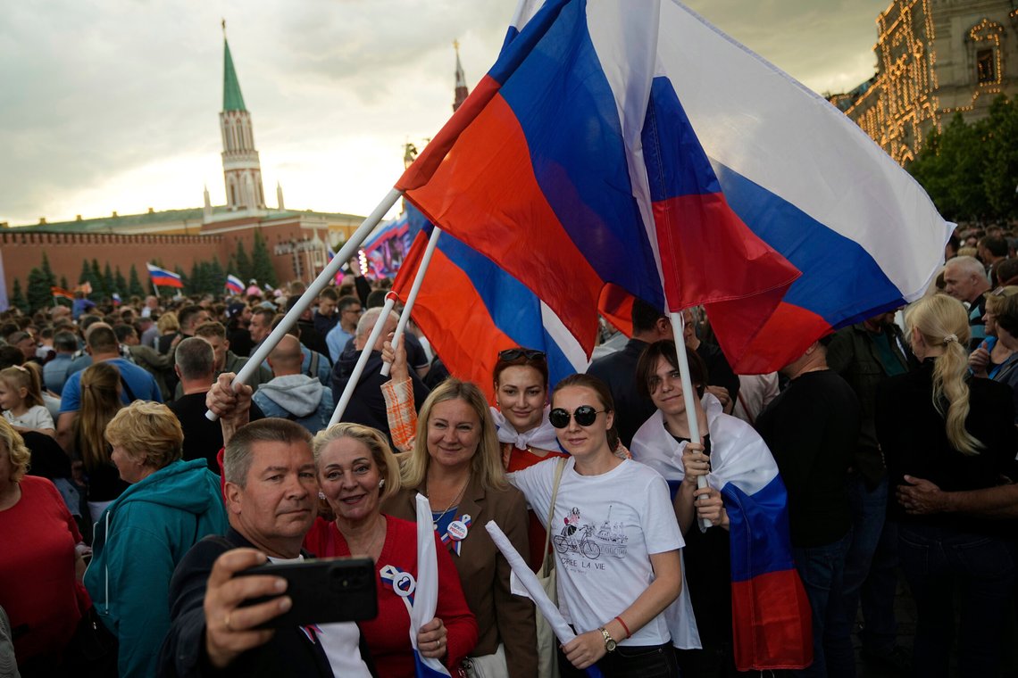 People take selfies while waving Russian national flags as thousands gather on Red Square to watch a concert dedicated to the upcoming Day of Russia in Moscow, Russia, Wednesday, June 11, 2025. (AP Photo/Pavel Bednyakov) People take selfies while waving Russian national flags as thousands gather on Red Square to watch a concert dedicated to the upcoming Day of Russia in Moscow, Russia, Wednesday, June 11, 2025. (AP Photo/Pavel Bednyakov)