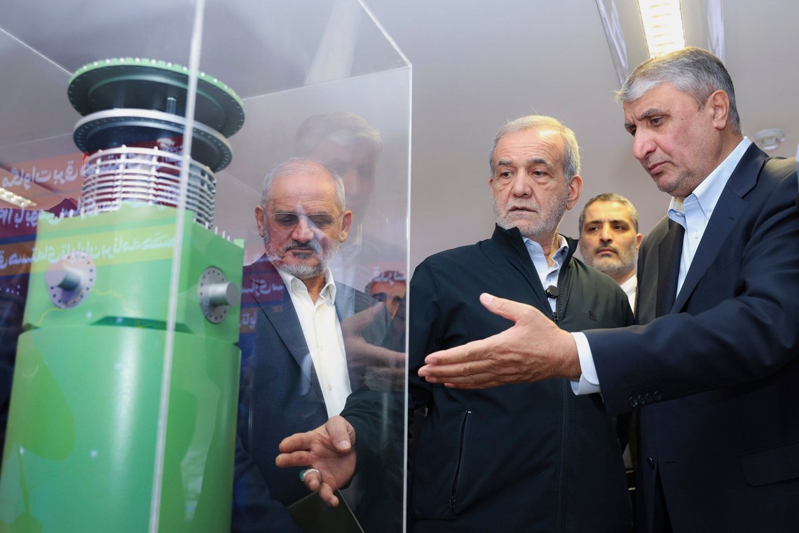 FILE - In this photo released by the Iranian Presidency Office, President Masoud Pezeshkian, second right, listens to Head of the Atomic Energy Organization of Iran Mohammad Eslami as he visits an exhibition of Iran's nuclear achievements in Tehran, Iran, April 9, 2025. (Iranian Presidency Office via AP) FILE - In this photo released by the Iranian Presidency Office, President Masoud Pezeshkian, second right, listens to Head of the Atomic Energy Organization of Iran Mohammad Eslami as he visits an exhibition of Iran's nuclear achievements in Tehran, Iran, April 9, 2025. (Iranian Presidency Office via AP)
