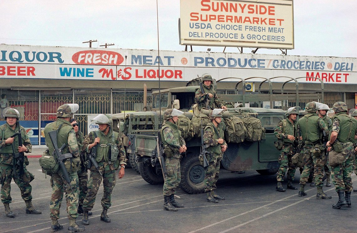 FILE - In this May 3, 1992, file photo, members of the 18th Calvary Squadron, a California National Guard unit, stand during a deployment in a south central during the 1992 riots in Los Angeles. (AP Photo/Joe Marquette, File) FILE - In this May 3, 1992, file photo, members of the 18th Calvary Squadron, a California National Guard unit, stand during a deployment in a south central during the 1992 riots in Los Angeles. (AP Photo/Joe Marquette, File)