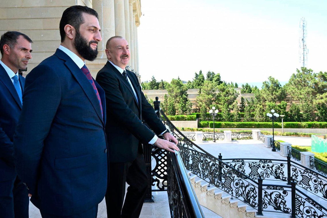 In this photo provided by Azerbaijan's Presidential Press Office, Azerbaijani President Ilham Aliyev, right, and Syria's interim president, Ahmad al-Sharaa, second left, stand on the balcony during their meeting in Baku, Azerbaijan, on Saturday, July 12, 2025. (Azerbaijani Presidential Press Office via AP) In this photo provided by Azerbaijan's Presidential Press Office, Azerbaijani President Ilham Aliyev, right, and Syria's interim president, Ahmad al-Sharaa, second left, stand on the balcony during their meeting in Baku, Azerbaijan, on Saturday, July 12, 2025. (Azerbaijani Presidential Press Office via AP)