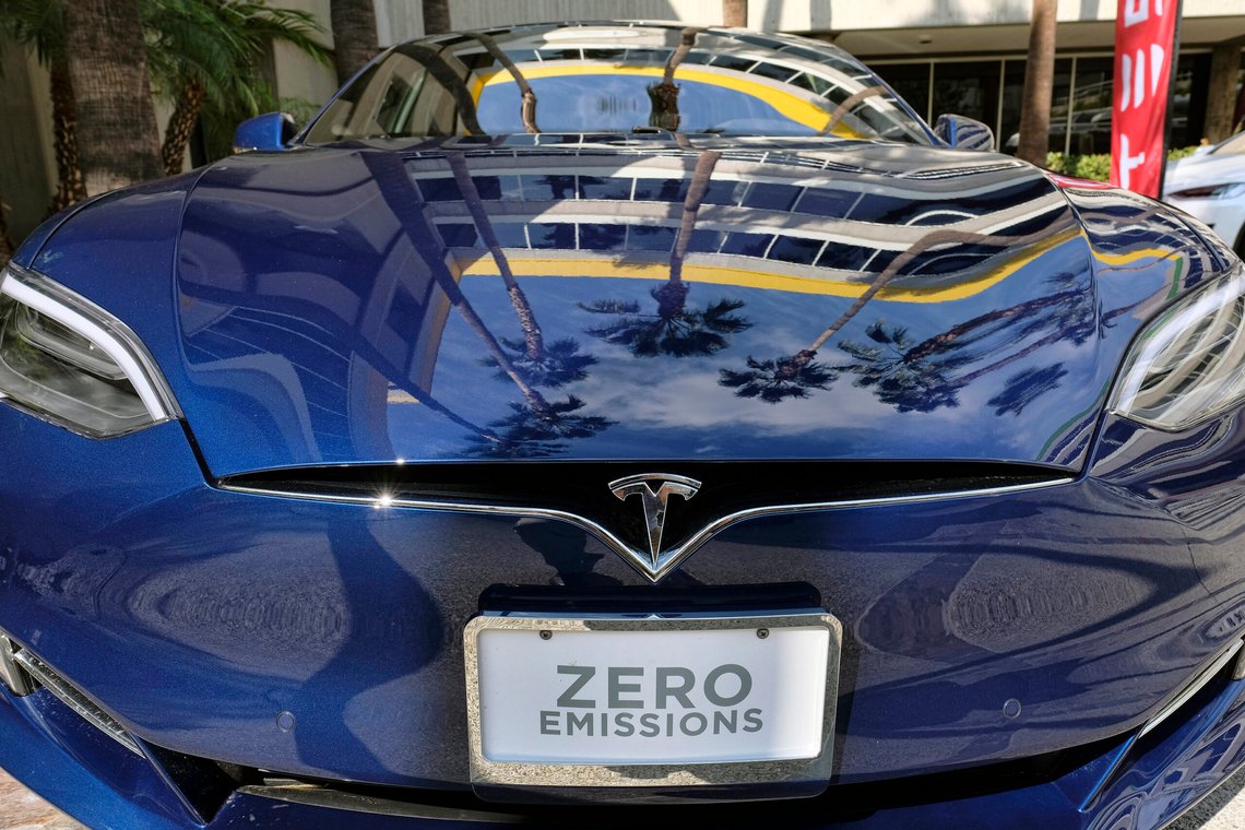 FILE - In this Oct. 24, 2016, file photo, palm trees are reflected on the hood of a Tesla Model S on display in downtown Los Angeles. Tesla says it recorded one accident for every 3.34 million miles driven when the autopilot was engaged.
That number of per-mile accidents rises to 1.92 million when autopilot is not on. (AP Photo/Richard Vogel, File) FILE - In this Oct. 24, 2016, file photo, palm trees are reflected on the hood of a Tesla Model S on display in downtown Los Angeles. Tesla says it recorded one accident for every 3.34 million miles driven when the autopilot was engaged.
That number of per-mile accidents rises to 1.92 million when autopilot is not on. (AP Photo/Richard Vogel, File)