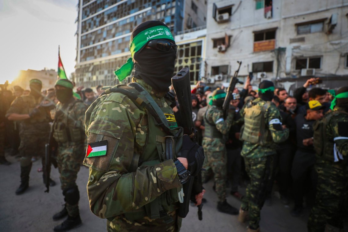 FILE - Fighters from the Qassam Brigades, the military wing of Hamas, control the crowd while Red Cross collect Israeli hostages to be released under a ceasefire agreement between Israel and Hamas, in Gaza City, Jan. 19, 2025. (AP Photo/Abed Hajjar, File) FILE - Fighters from the Qassam Brigades, the military wing of Hamas, control the crowd while Red Cross collect Israeli hostages to be released under a ceasefire agreement between Israel and Hamas, in Gaza City, Jan. 19, 2025. (AP Photo/Abed Hajjar, File)