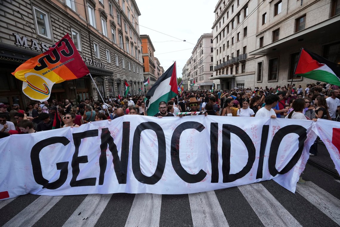Demonstrators hold a banner reading "genocide" in Rome, Monday, Sept. 22, 2025, during a nation-wide protest and general strike against the war in Gaza. (AP Photo/Alessandra Tarantino) Demonstrators hold a banner reading "genocide" in Rome, Monday, Sept. 22, 2025, during a nation-wide protest and general strike against the war in Gaza. (AP Photo/Alessandra Tarantino)